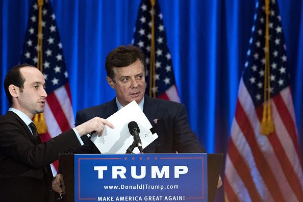 Paul Manafort checks a podium before Trump speaks at an event at Trump SoHo Hotel.