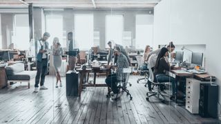 An IT team in an office busy at work