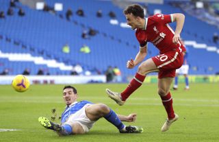 Liverpool’s Diogo Jota (right) has a shot blocked by Brighton and Hove Albion’s Lewis Dunk during the Premier League match at the AMEX Stadium, Brighton