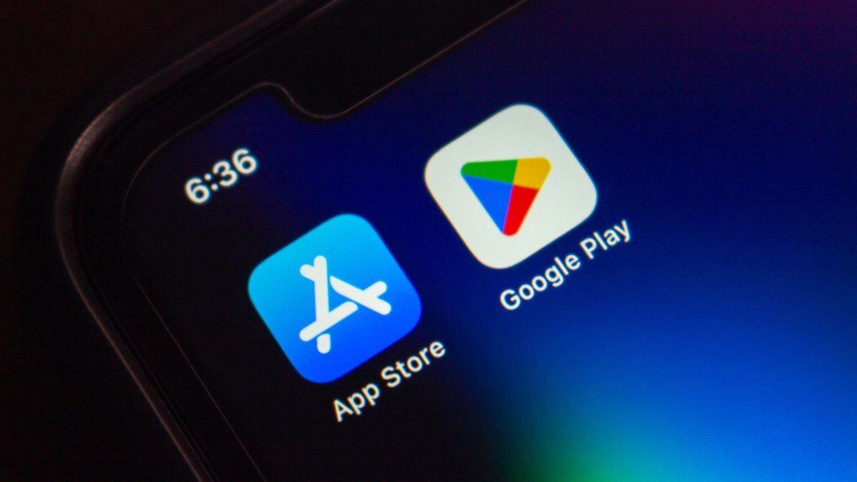 Close-up of a smartphone screen showing the App Store and Google Play app icons side by side on a dark background.; Shutterstock ID 2674035489;
