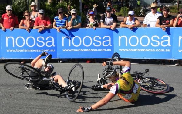 Two women crashed on the tight corner as spectators looked on.