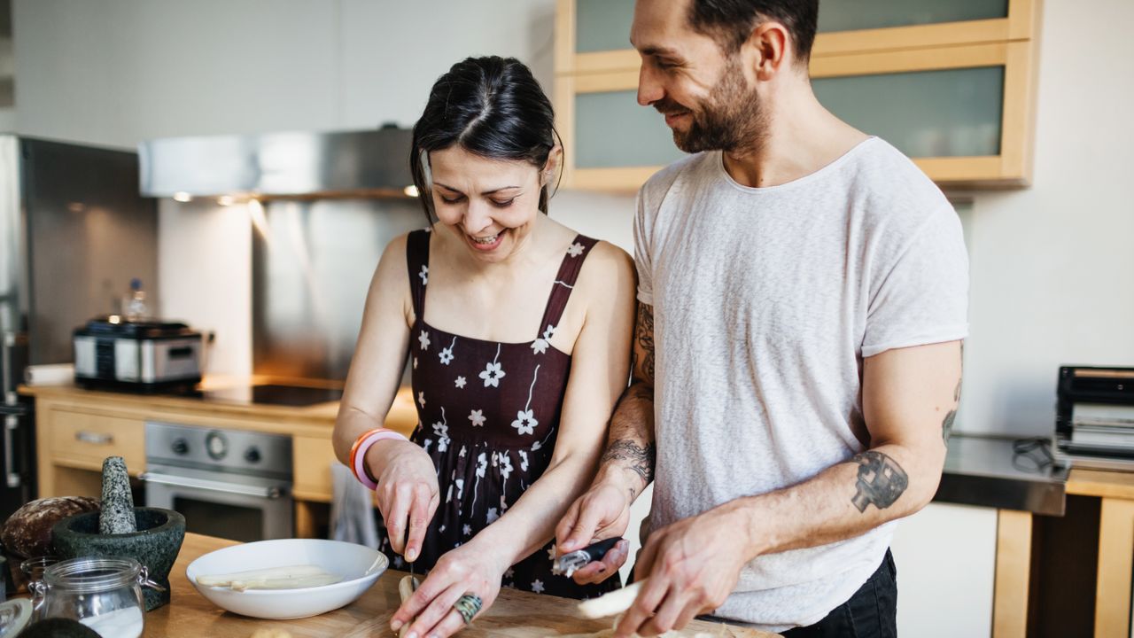 Man and woman preparing food