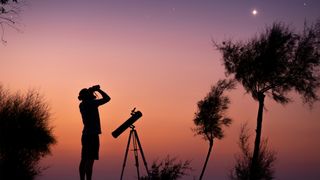 person using binoculars to look at the stars