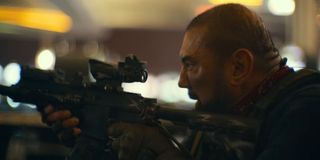 Dave Bautista firing a gun in Army of the Dead