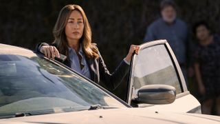 Renée Ballard (Maggie Q) steps out of a car in a scene from Prime Video's new "Bosch" spinoff, "Ballard"