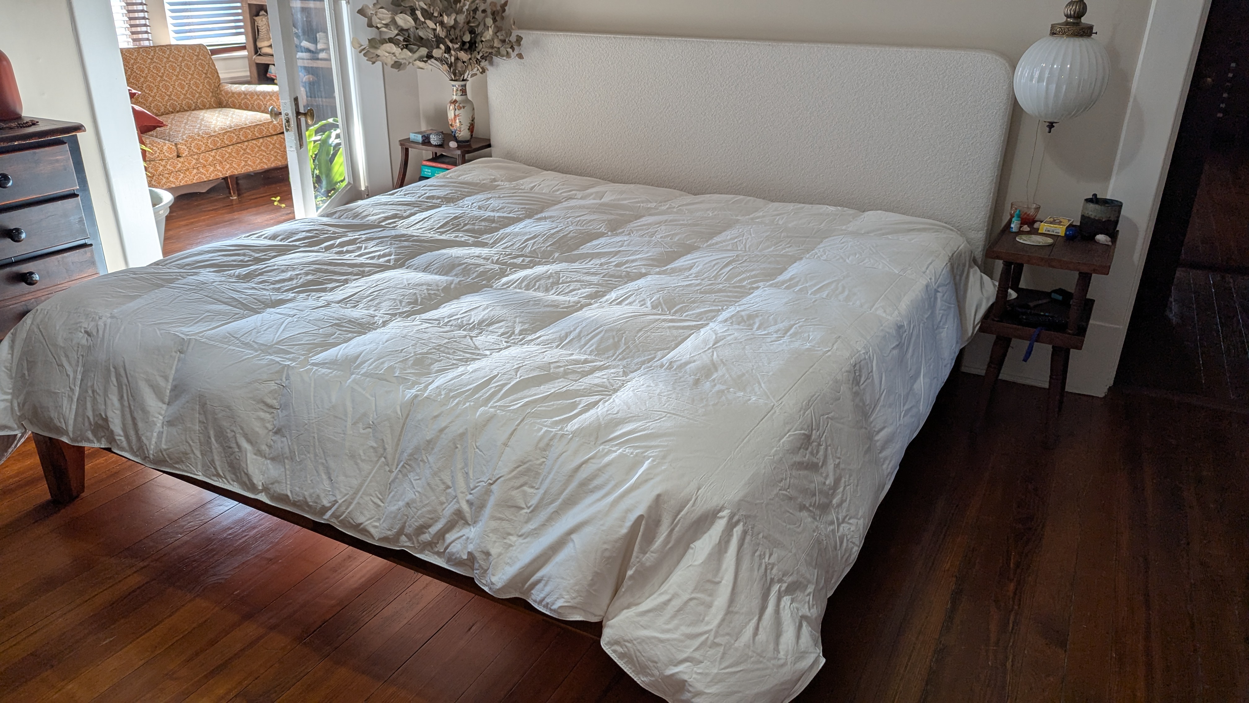 A white down comforter in bed