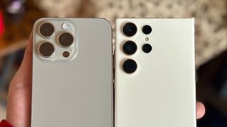 Apple iPhone 15 Pro Max next to Galaxy S23 Ultra showing back cameras