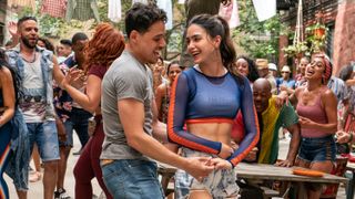 anthony ramos and marissa barbera dance at a party in the street in the movie In the Heights