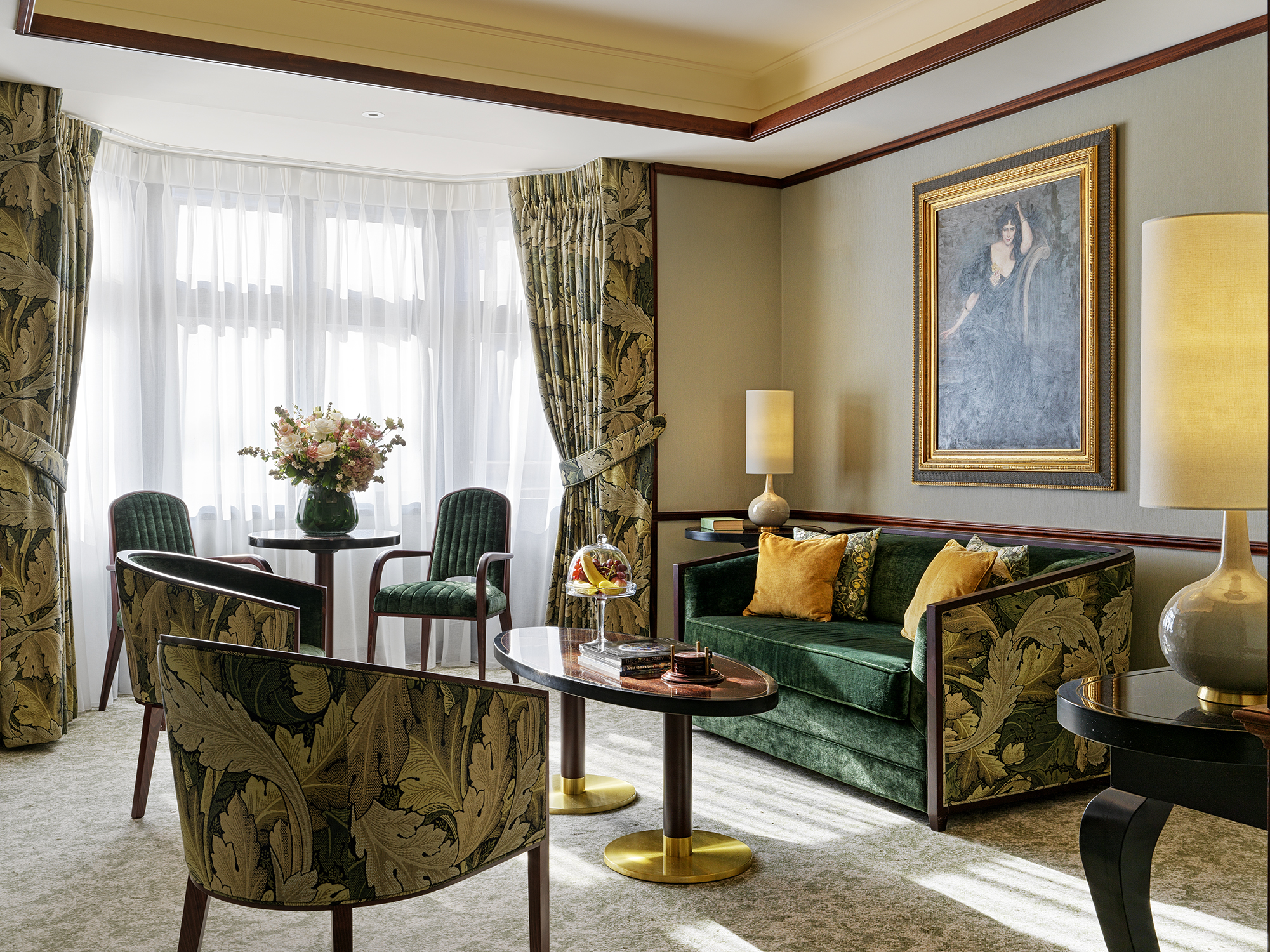 Floral patterned chairs and couch in a suite at The Stafford London