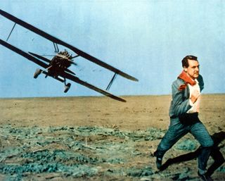 cary grant runs away from a low hanging plane in the movie North by Northwest