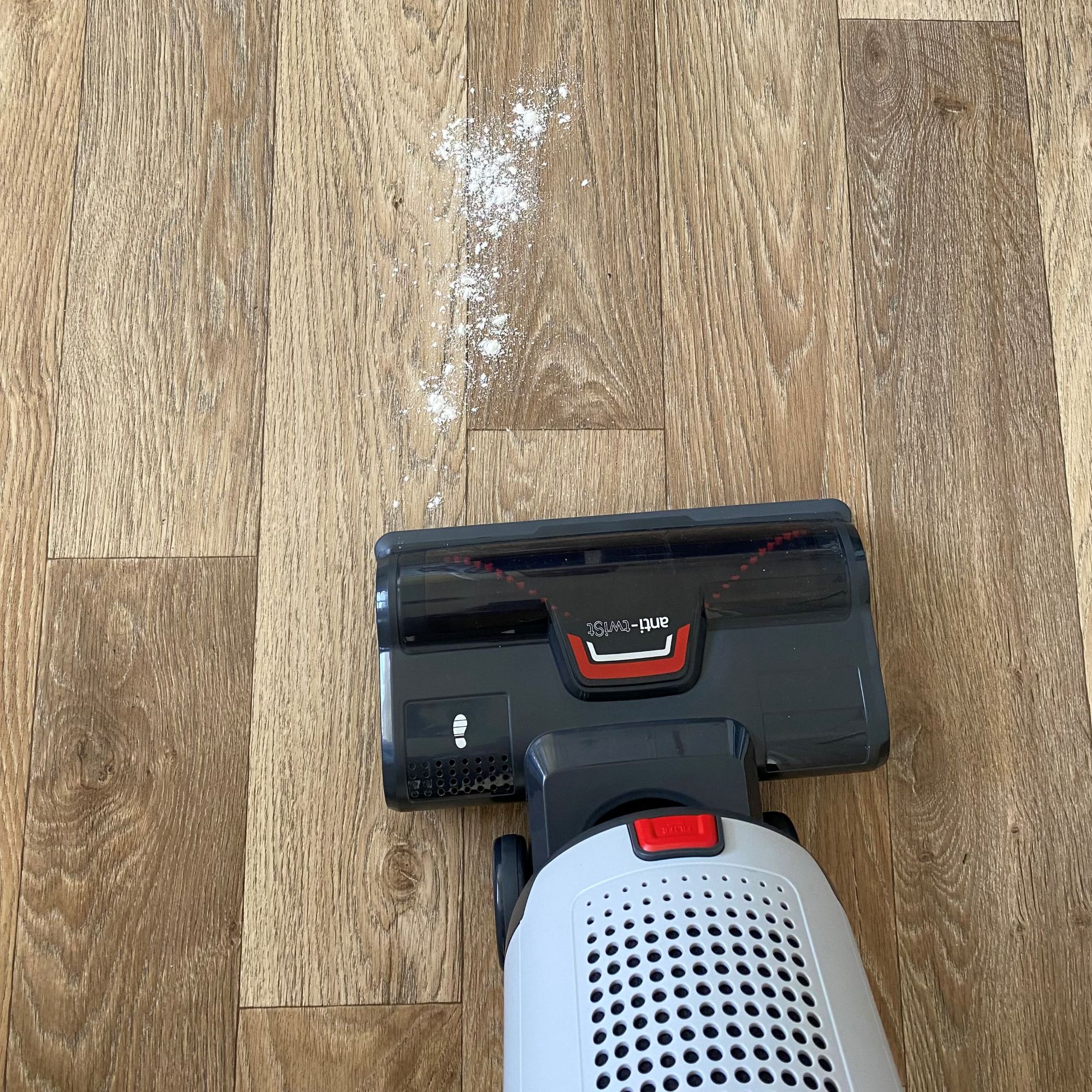 Hoover HL4 Upright Vacuum Cleaner vacuuming flour off hard floor
