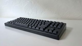 The Drop CSTM80 mechanical keyboard on a white table