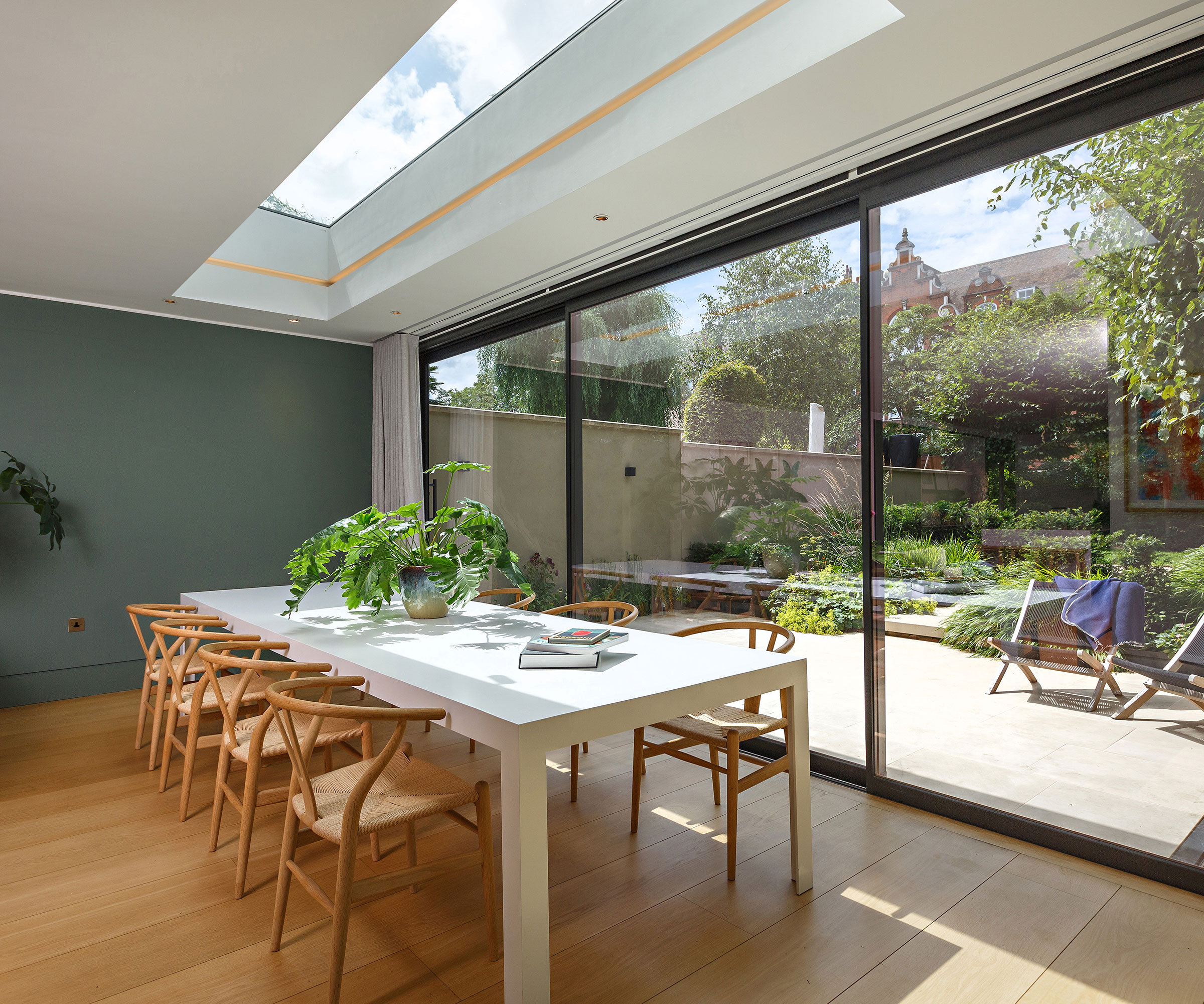 modern open plan dining room with rectangular roof lantern