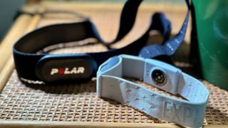 The Polar H10 and COROS Heart Rate Monitor straps side-by-side on a shelf.