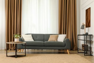 Full length brown curtains in a contemporary living room