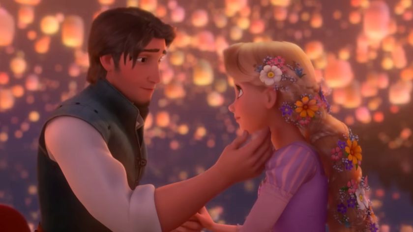 Flynn holding Rapunzel's face as lanters fly around them. 