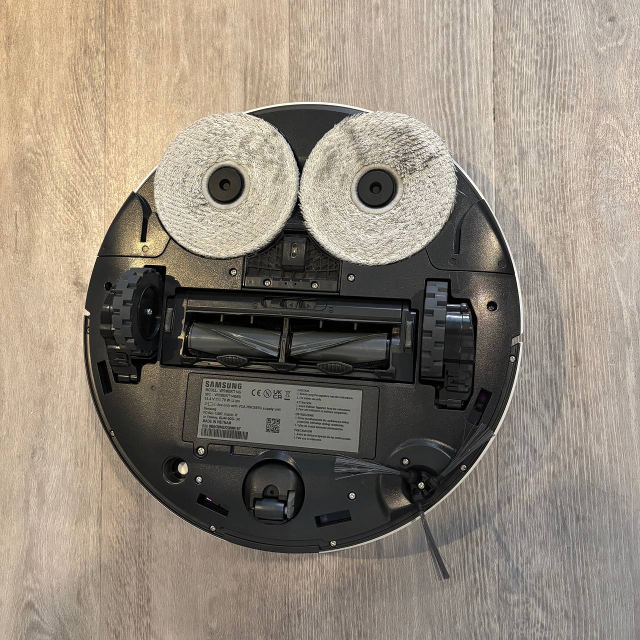 Bottom view of the Samsung Jet Bot Combo showing mop pads, wheels and rolling brush