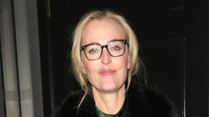 Gillian Anderson wearing velvet midi dress at War Child gala dinner on December 4, 2025 in London, England