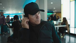 Jason Bateman as the Mysterious Traveler in "Carry-On" now streaming on Netflix