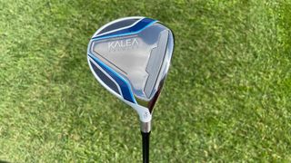 TaylorMade Kalea Premier Fairway Wood held up on the golf course