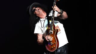 Slash performs onstage with Guns N' Roses