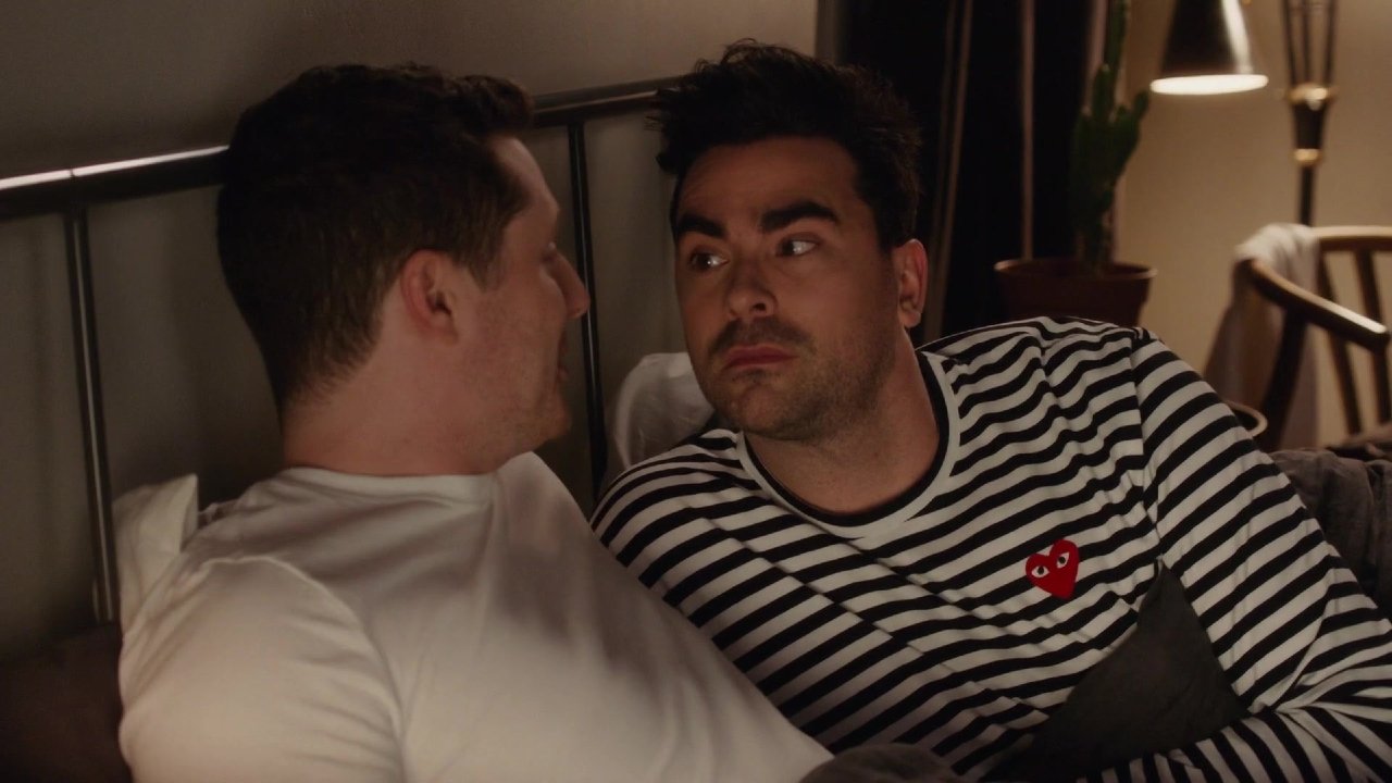 Noah Reid and Dan Levy having a talk in bed in Schitt&#039;s Creek.