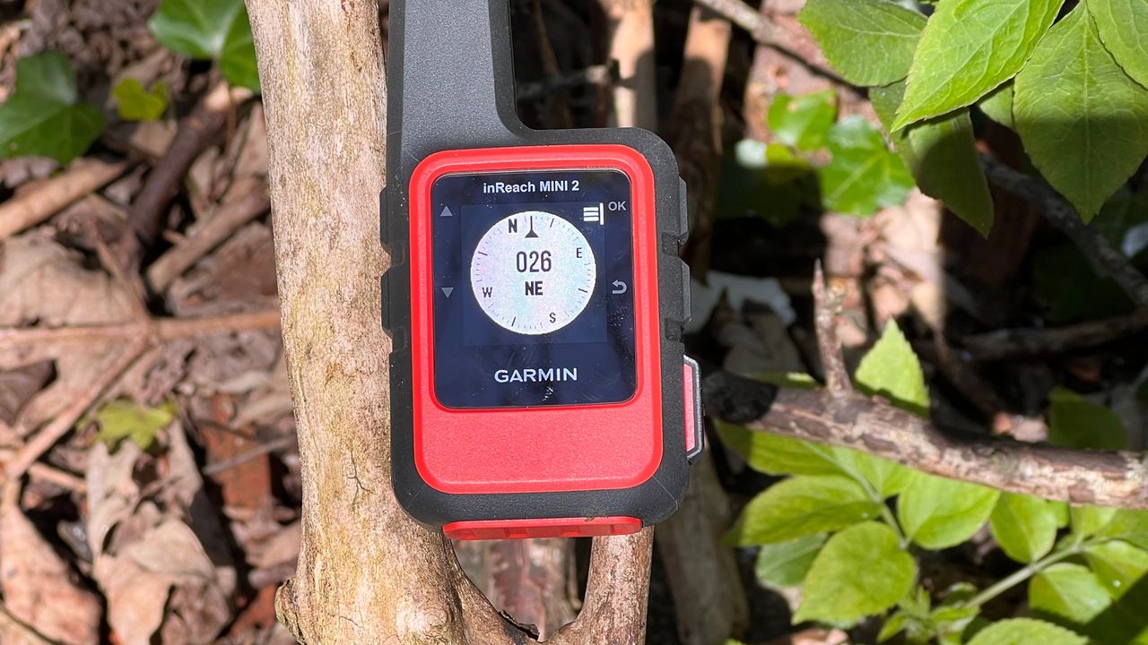 Garmin inReach Mini 2 hiking GPS in someone&#039;s hand