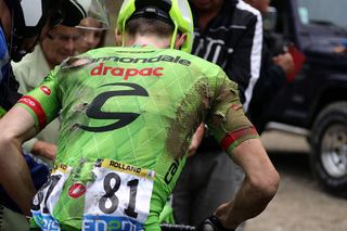 Pierre Rolland (Cannondale) takes a tumble on the slippery roads, stage 19 at the Tour de France