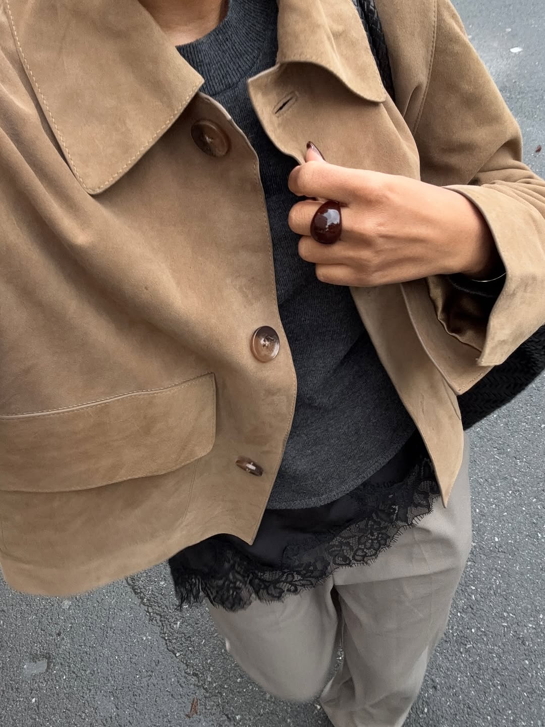 woman wearing winter to spring transitional jacket trends 2026