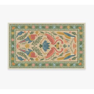 Iris Apfel rectangle rug with green floral border and large colorful parrots and flamingos with foliage in the central body