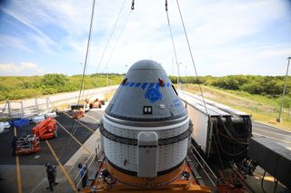 Boeing’s CST-100 Starliner spacecraft rolls out from the company’s Commercial Crew and Cargo Processing Facility at NASA’s Kennedy Space Center in Florida on May 4, 2022.