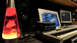 A lava lamp and studio monitor in a recording studio