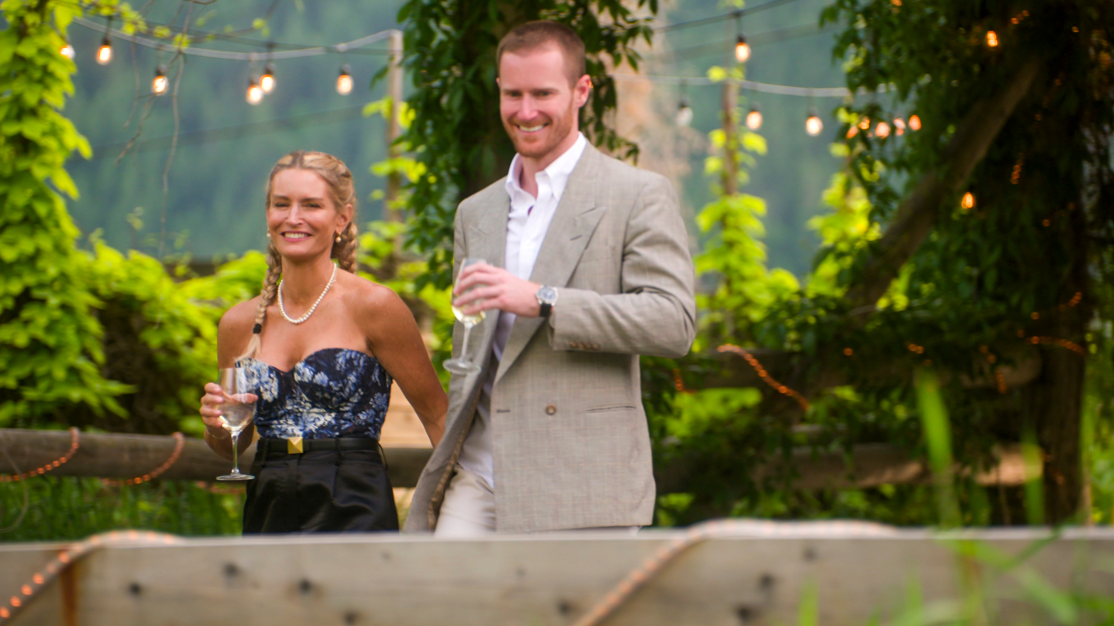 Theresa Demaria and John Merrill wearing formal outfits while arriving at a winery in the first episode of age of attraction