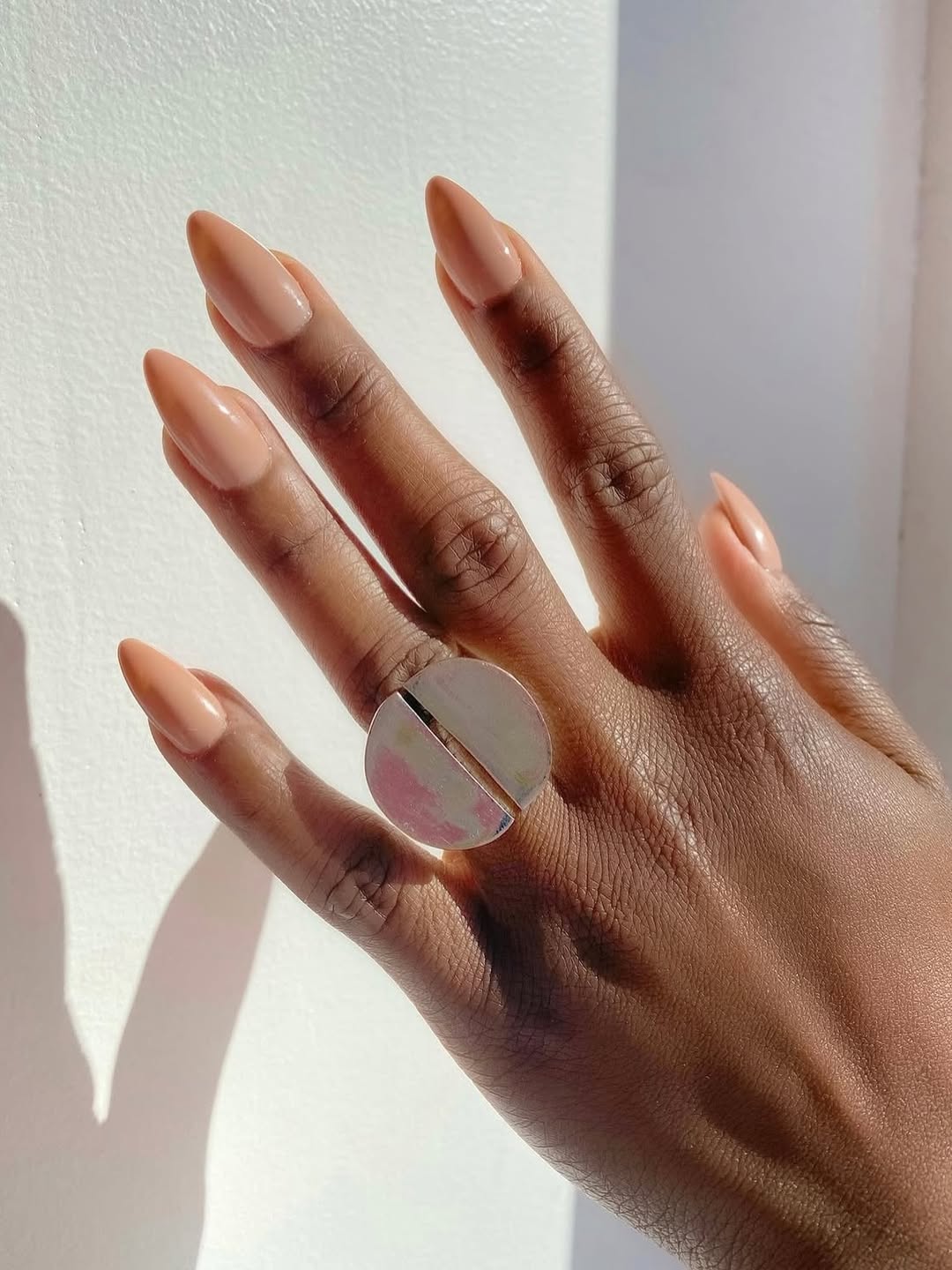 A muted camel manicure by Queenie Nguyen.
