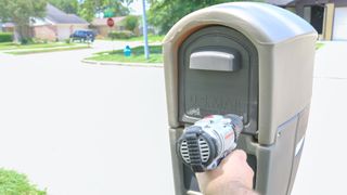 Drilling a hole in the back of a mailbox for the Ring Mailbox Sensor's antenna