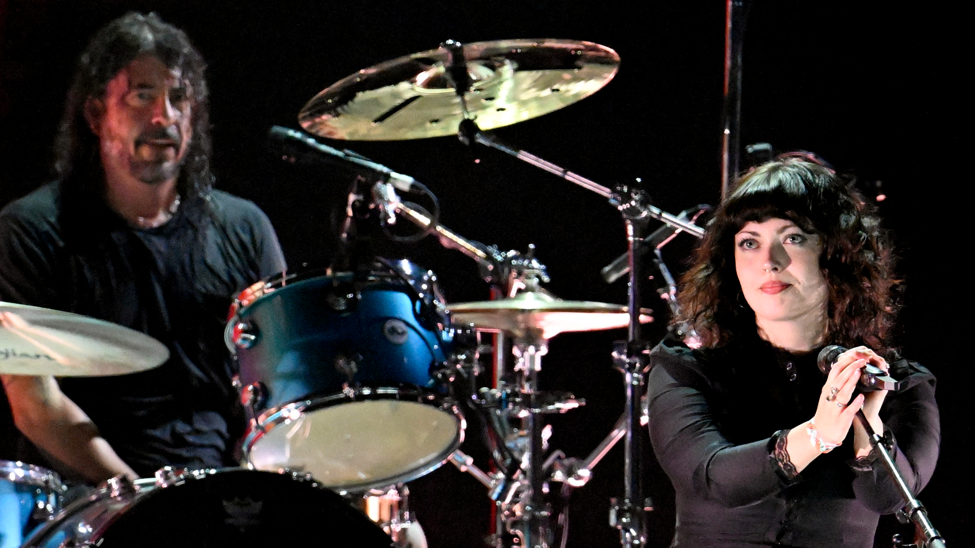 Violet Grohl (R) performs onstage with Dave Grohl
