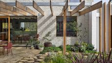 A backyard with a herd of potted plants