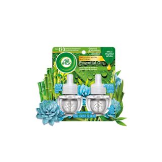 Two essential oi air freshener refill bottles in a green packet
