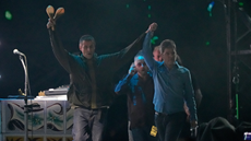 Liam Gallagher and Noel Gallagher of British rock band Oasis perform the opening concert of their reunion tour