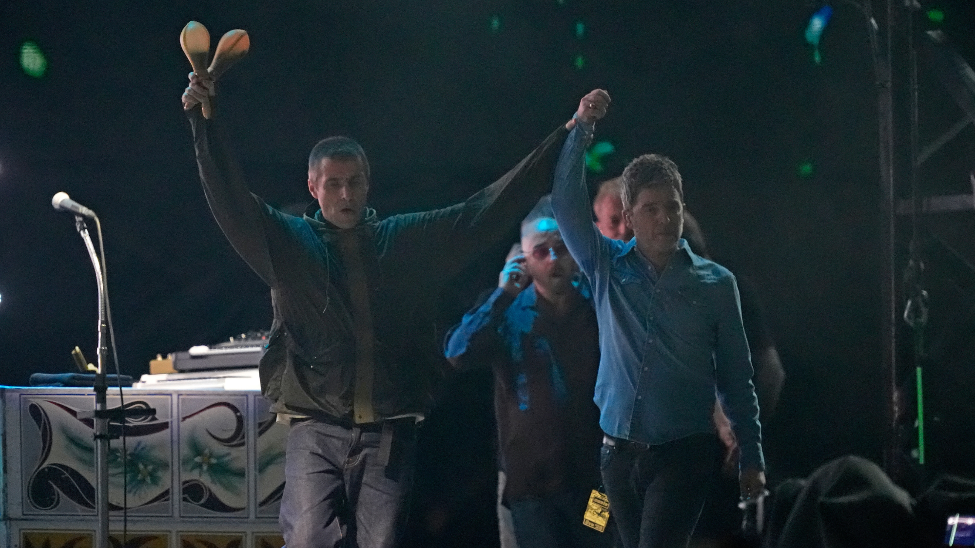 Liam Gallagher and Noel Gallagher of British rock band Oasis perform the opening concert of their reunion tour