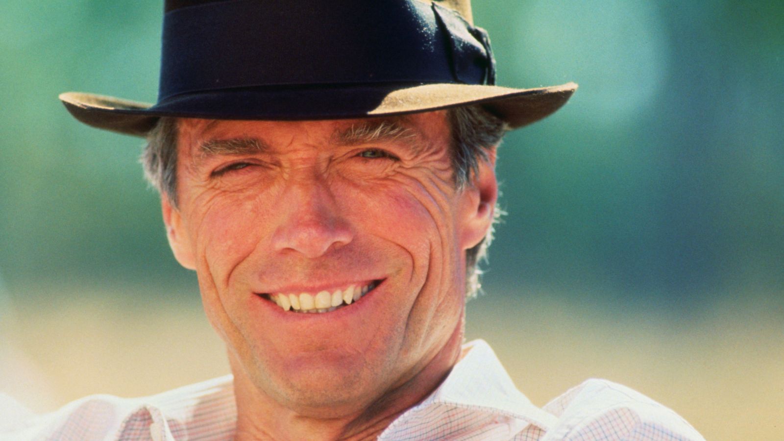 clint eastwood on a green background
