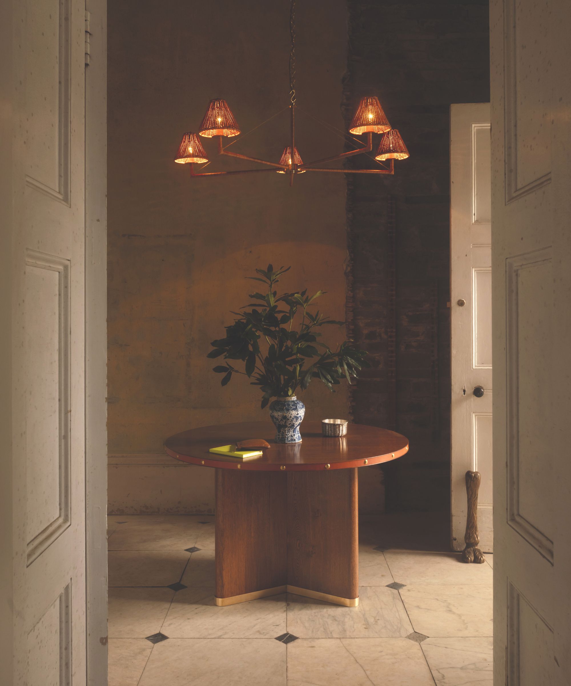 Wooden circular dining table in a hallway