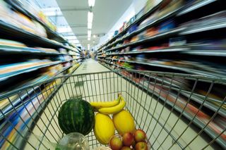 Shopping trolley charging down a supermarket aisle