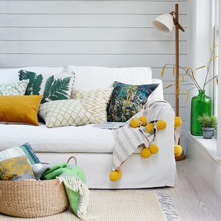 white sofa with cushions