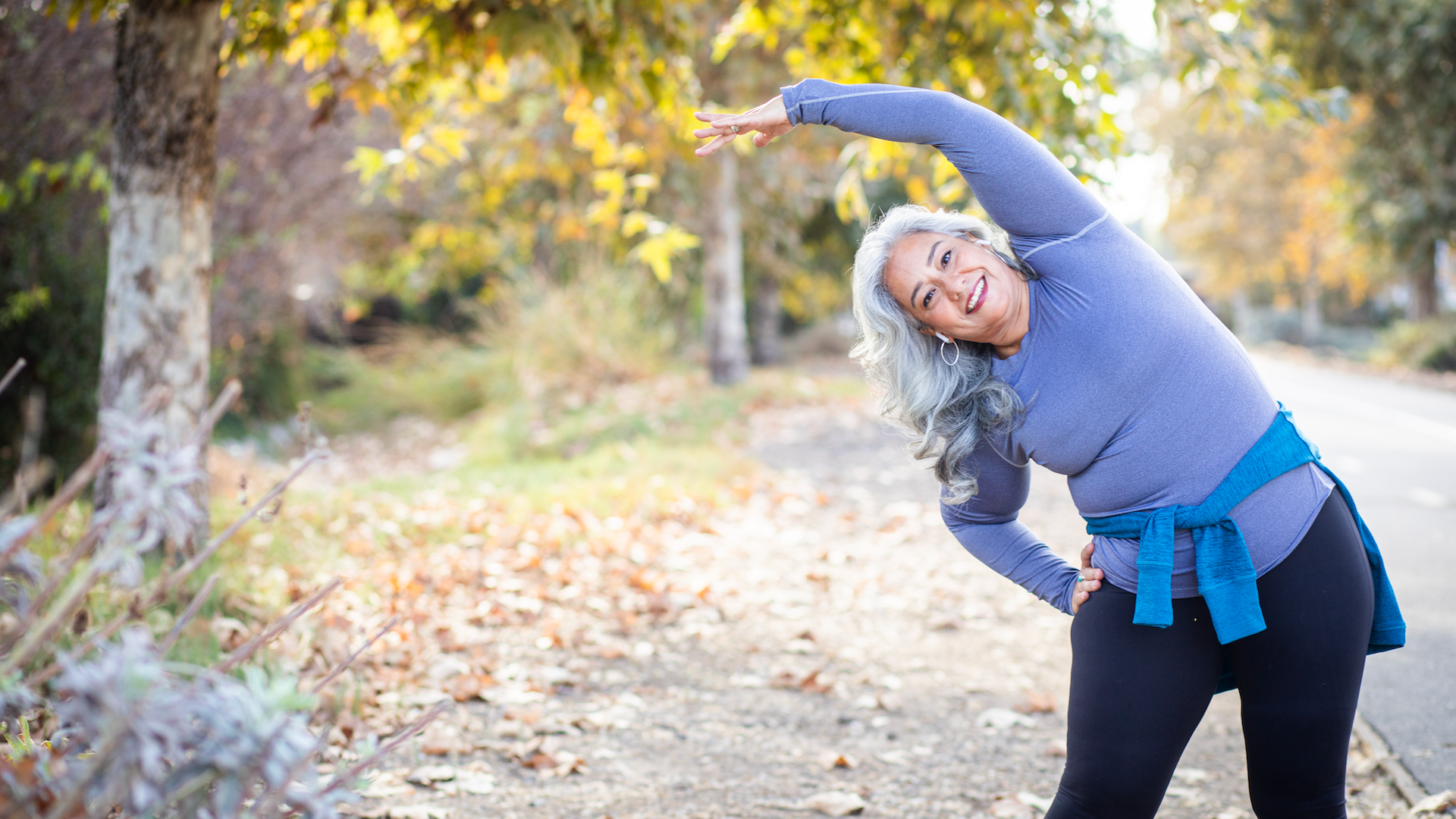 Woman stretching during walk
