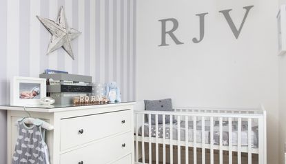 Grey nursery chair in grey nursery