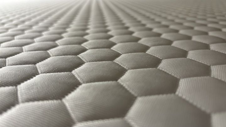 A closeup look of the heat-dissipating cover of the Helix Premium Memory Foam Mattress Topper with GlacioTex