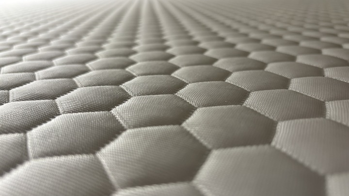 A closeup look of the heat-dissipating cover of the Helix Premium Memory Foam Mattress Topper with GlacioTex