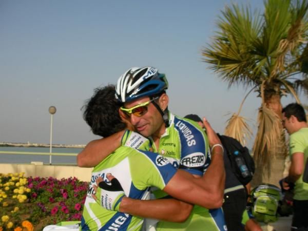 Chicchi gets an emotional embrace from one of his teammates