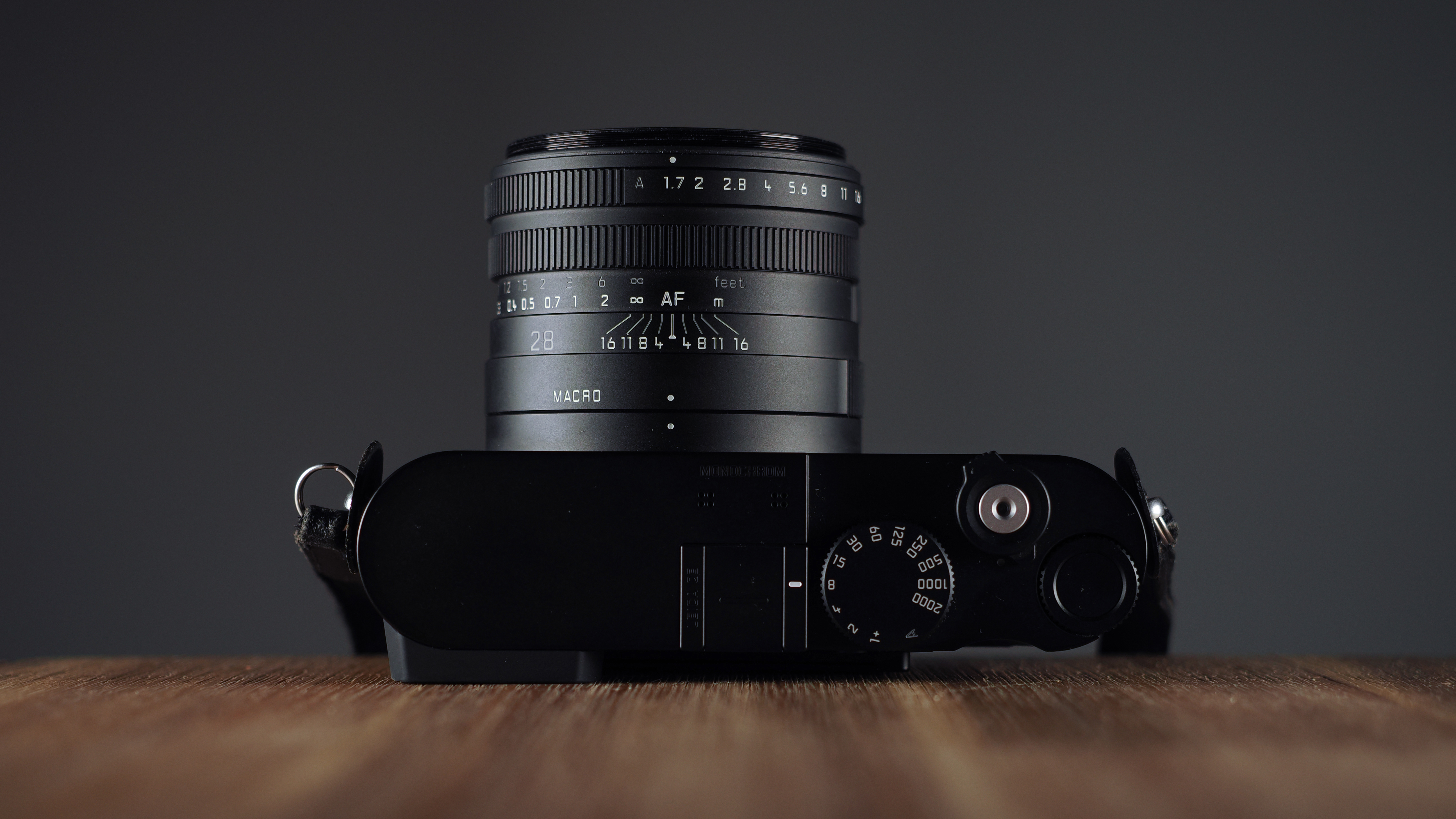 Leica Q3 Monochrom on a wooden surface